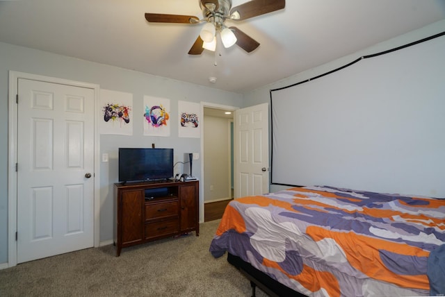 bedroom with ceiling fan and carpet floors