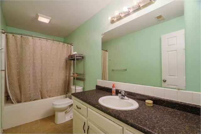 full bathroom with shower / bathtub combination with curtain, tile patterned flooring, vanity, and toilet