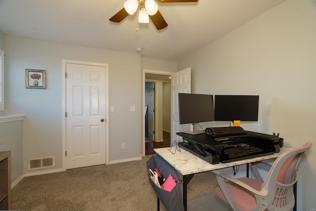 carpeted office with ceiling fan