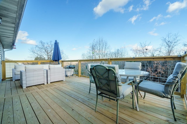 wooden deck featuring outdoor lounge area