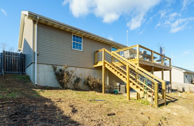 rear view of property with a wooden deck