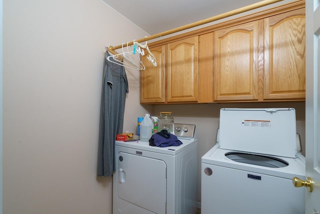 laundry area featuring cabinets and independent washer and dryer