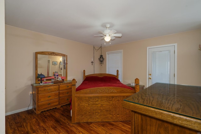 bedroom with ceiling fan and dark wood-type flooring