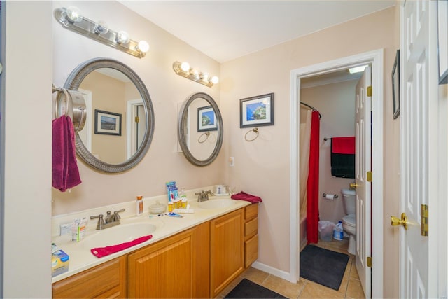 full bathroom featuring shower / bath combo with shower curtain, tile patterned flooring, vanity, and toilet