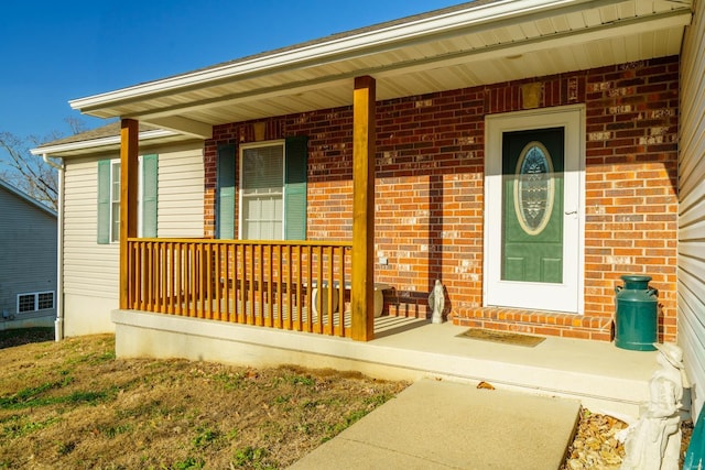 doorway to property featuring covered porch