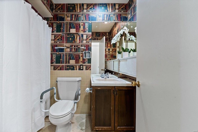 bathroom with tile patterned flooring, vanity, and toilet