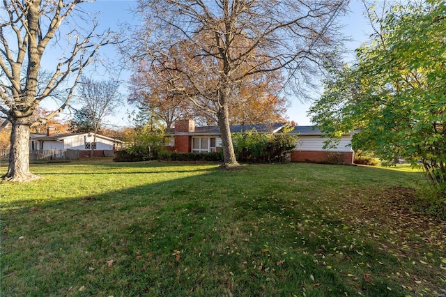 view of yard with fence