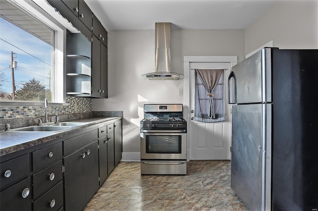 kitchen featuring decorative backsplash, sink, wall chimney range hood, and appliances with stainless steel finishes