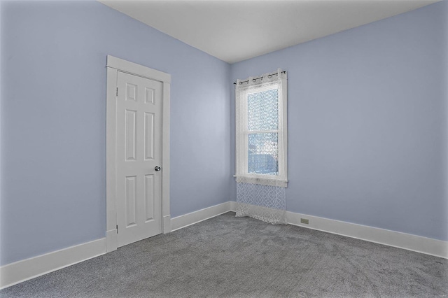 spare room featuring carpet floors