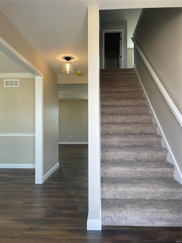 staircase featuring hardwood / wood-style flooring