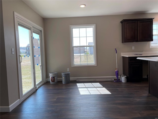 unfurnished dining area with dark hardwood / wood-style floors