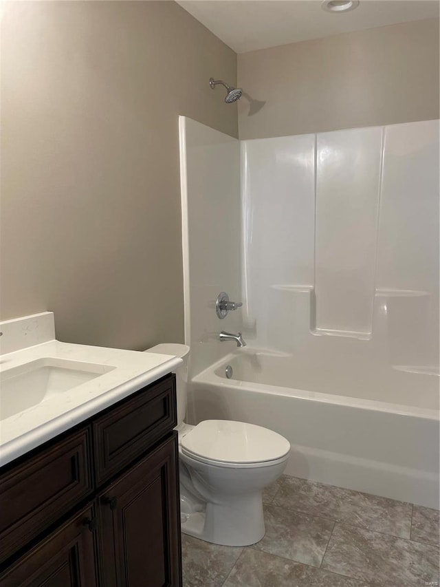 full bathroom with vanity, tub / shower combination, and toilet