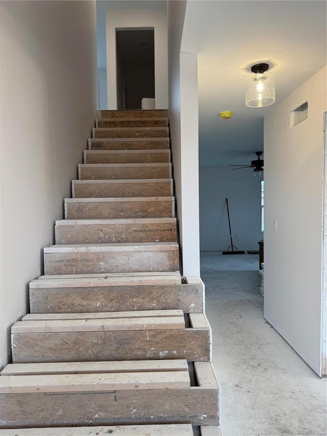 staircase with ceiling fan