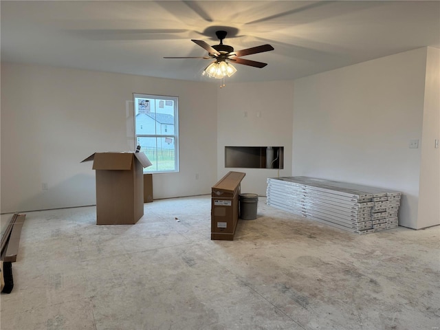 unfurnished living room featuring ceiling fan