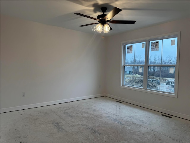 unfurnished room with ceiling fan