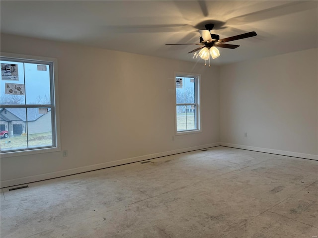 unfurnished room with ceiling fan