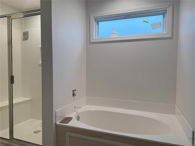 bathroom with separate shower and tub