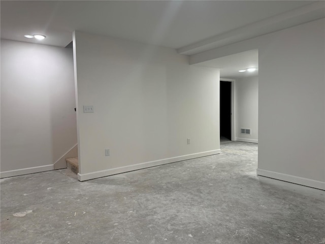 empty room with concrete flooring