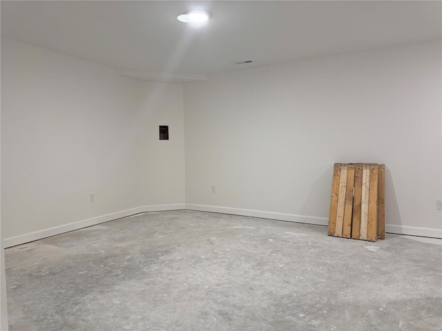 unfurnished room with concrete floors