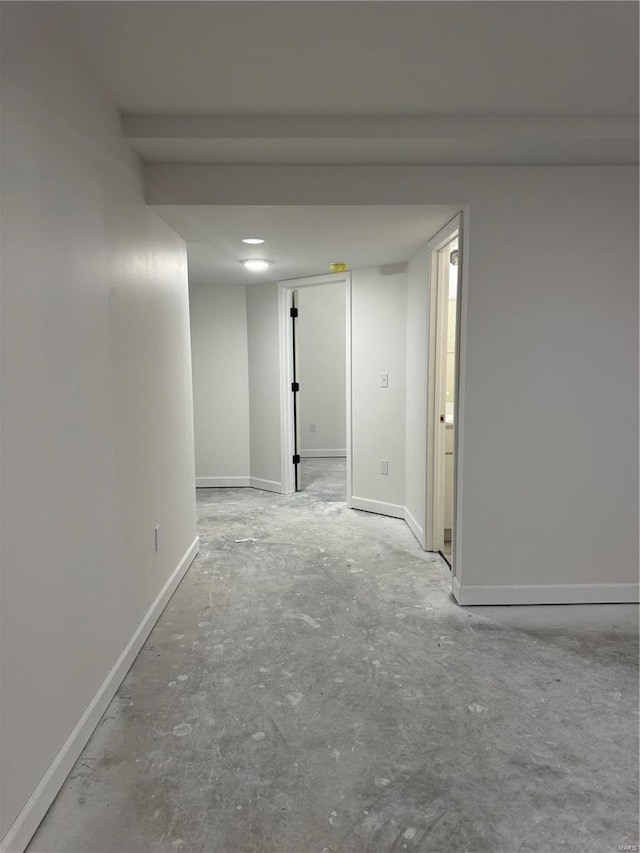 unfurnished room with concrete floors