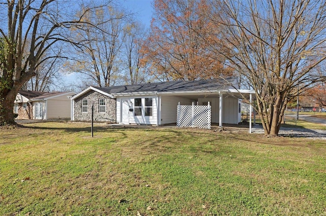 ranch-style home with a front lawn