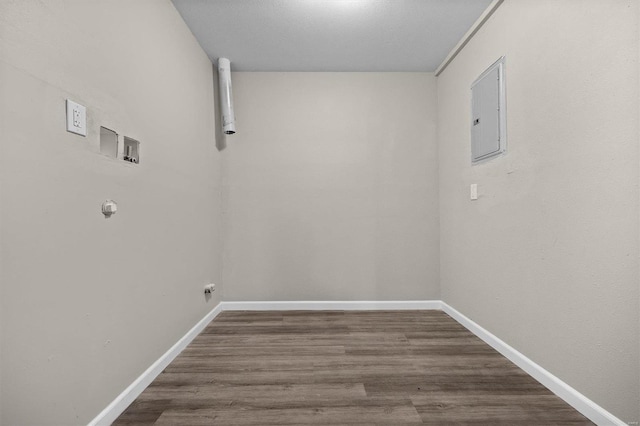 washroom with washer hookup, wood-type flooring, and electric panel