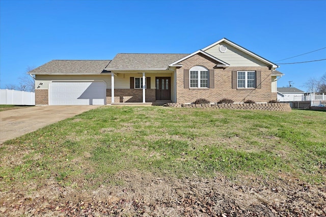 ranch-style house with covered porch, a garage, and a front lawn