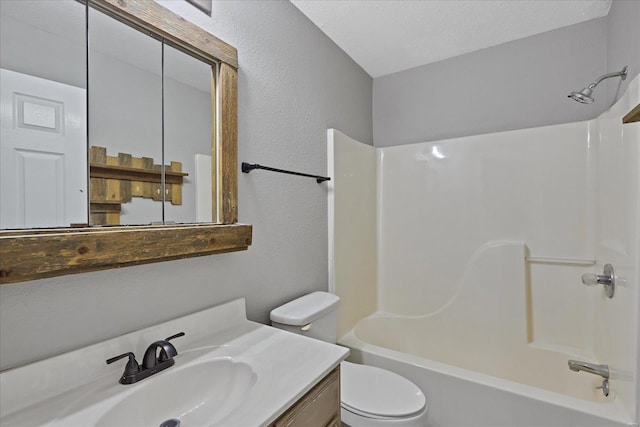 full bathroom with a textured ceiling, vanity, toilet, and tub / shower combination