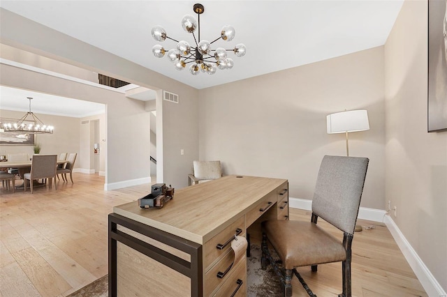 office space featuring light hardwood / wood-style floors and a notable chandelier