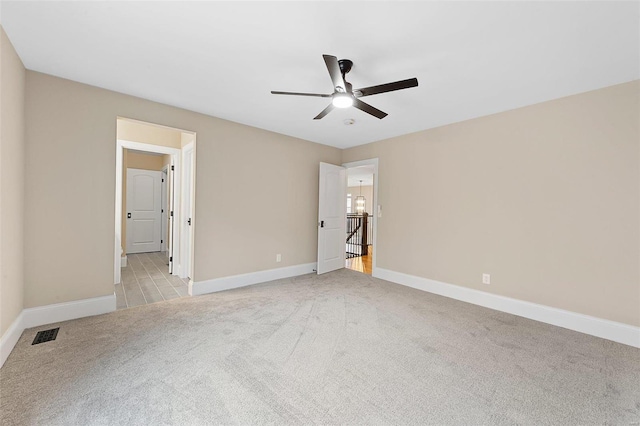 unfurnished bedroom with ceiling fan and light carpet