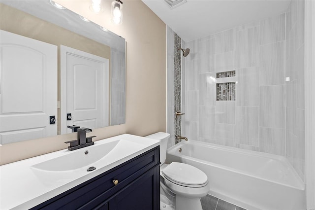 full bathroom featuring tile patterned floors, vanity, shower / bathtub combination, and toilet