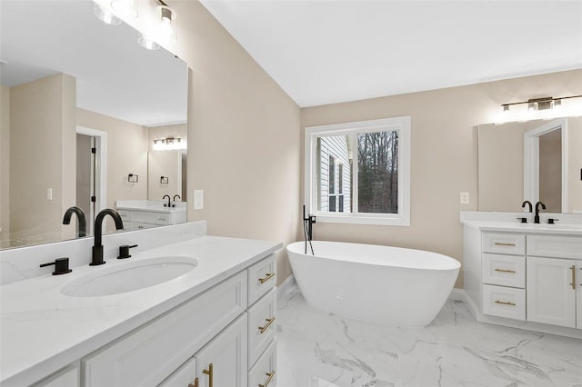 bathroom with a bathtub and vanity