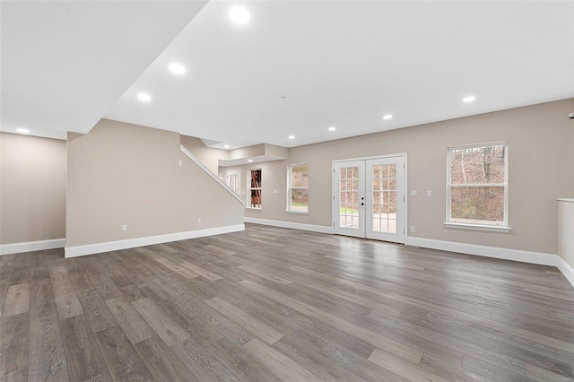 unfurnished living room with french doors and hardwood / wood-style flooring