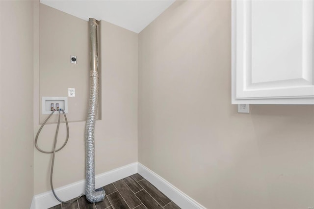 laundry room with hookup for an electric dryer, washer hookup, and cabinets