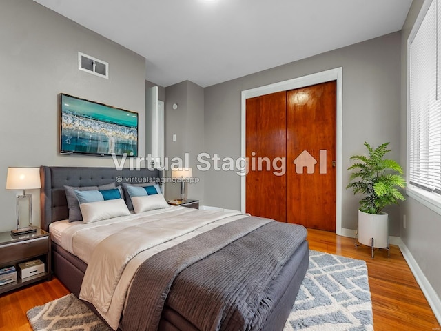 bedroom with a closet and light wood-type flooring