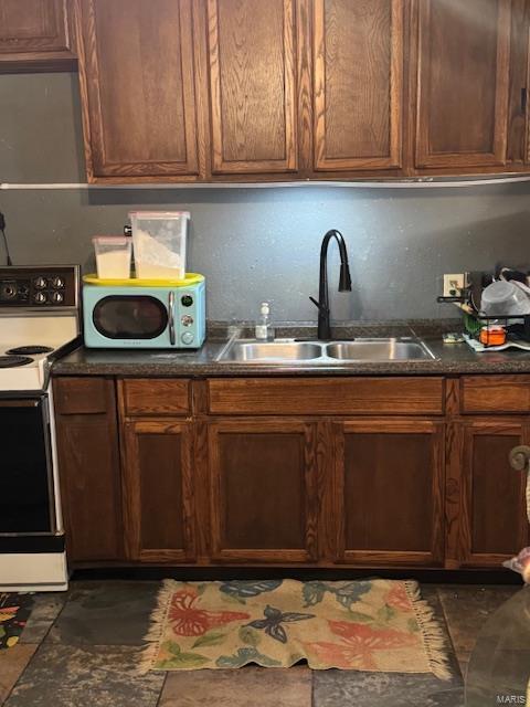 kitchen featuring sink and white appliances