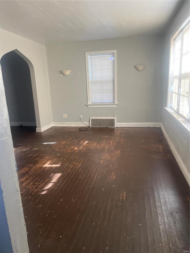 spare room featuring dark hardwood / wood-style flooring