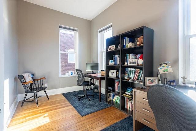 office space with hardwood / wood-style floors