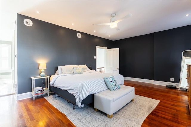 bedroom featuring hardwood / wood-style flooring and ceiling fan