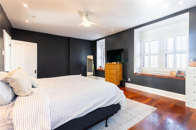 bedroom featuring ceiling fan and dark wood-type flooring