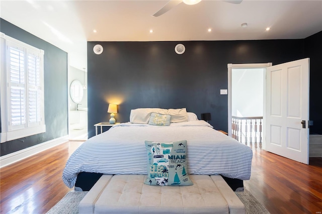 bedroom with wood-type flooring and ceiling fan