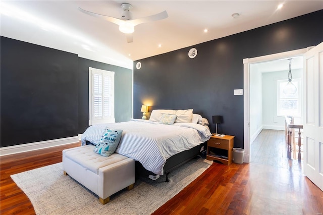 bedroom featuring hardwood / wood-style floors and ceiling fan