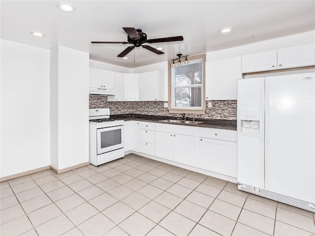 kitchen featuring decorative backsplash, white appliances, ceiling fan, sink, and white cabinets