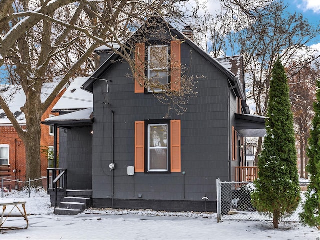 view of snow covered house