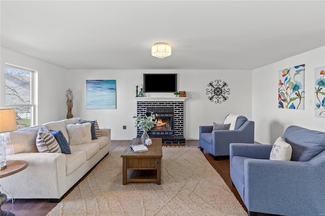 living room with a fireplace and hardwood / wood-style floors