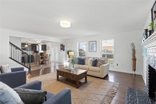 living room with hardwood / wood-style floors and a fireplace