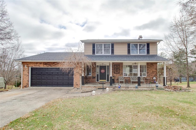 front of property featuring a garage, covered porch, and a front lawn