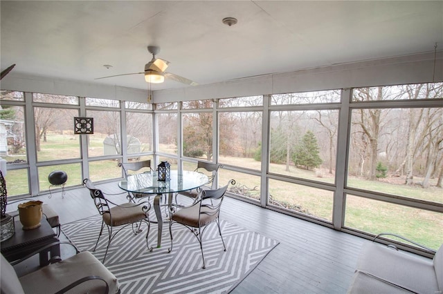 sunroom / solarium with ceiling fan