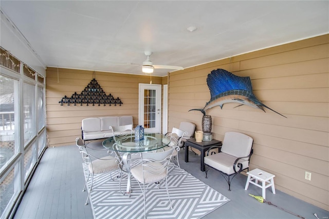 sunroom featuring ceiling fan