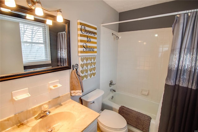 full bathroom featuring vanity, decorative backsplash, toilet, tile walls, and shower / tub combo